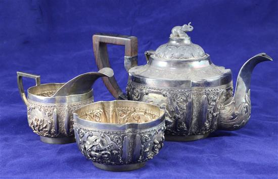 A heavy late 19th century Indian three piece silver tea set,